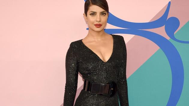 Priyanka Chopra looks sizzling hot in black Michael Kors gown. See