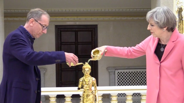 Prime Minister Theresa May and her husband Philip May performing the ‘abhishek’ ritual at the BAPS Shri Swaminarayan temple in northwest London. (HT Photo) Prime Minister Theresa May and her husband Philip May performing the ‘abhishek’ ritual at the BAPS Shri Swaminarayan temple in northwest London. (HT Photo)
