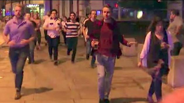 A still from the video showing the man fleeing the attacks while holding a pint of beer (R) in London on Saturday night. (Twitter) A still from the video showing the man fleeing the attacks while holding a pint of beer (R) in London on Saturday night. (Twitter)