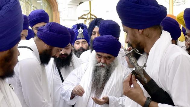 Damdami Taksal chief Harnam Singh Dhumma along with others at Akal Takht Sahib. (Gurpreet Singh/HT Photo)