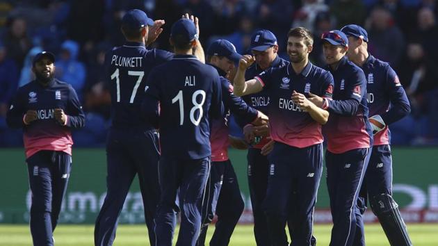 England players celebrate after dismissing a New Zealand batsman during an ICC Champions Trophy 2017 match in Cardiff. Get full cricket score of England vs New Zealand match here(AFP)