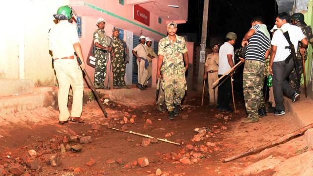 Police patrol Sukurhutu village on Monday night following a communal flare-up. (HT Photo) Police patrol Sukurhutu village on Monday night following a communal flare-up. (HT Photo)