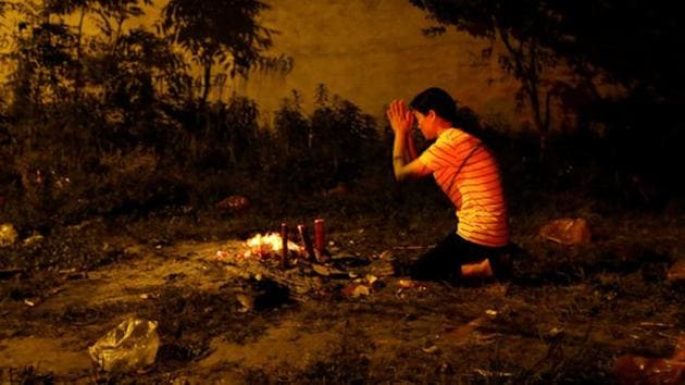 A mother prays ahead for her child ahead of the gaokao test. (Jason Lee/REUTERS) A mother prays ahead for her child ahead of the gaokao test. (Jason Lee/REUTERS)
