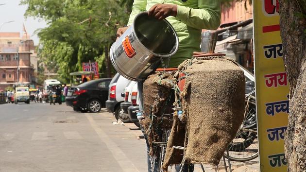 A good Samaritan refills earthen pitchers kept to quench the thirst of those passing by at noon. Such facilities may often save lives in Rajasthan where temperatures rise beyond 46 degrees Celsius in summers. (HimanSHU VYAS / HT PHOTO) A good Samaritan refills earthen pitchers kept to quench the thirst of those passing by at noon. Such facilities may often save lives in Rajasthan where temperatures rise beyond 46 degrees Celsius in summers. (HimanSHU VYAS / HT PHOTO)
