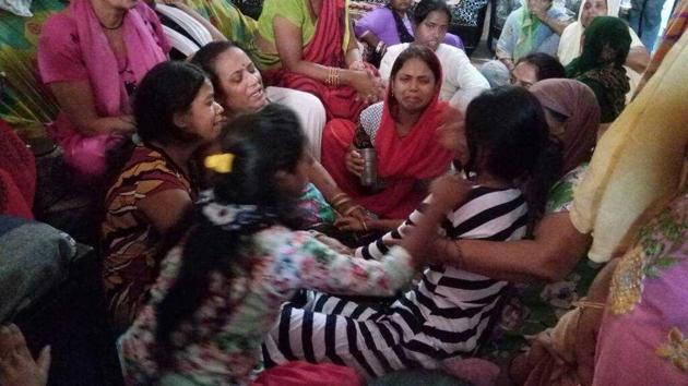 Neighbours and relatives console family of Manit, one of the boys who drowned. (Sourced) Neighbours and relatives console family of Manit, one of the boys who drowned. (Sourced)