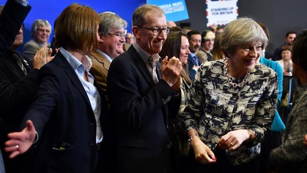 Britain's Prime Minister and leader of the Conservative Party Theresa May (R) and her husband Philip (C) leave after a general election campaign event in Norwich. (Ben Stansall/AFP) Britain's Prime Minister and leader of the Conservative Party Theresa May (R) and her husband Philip (C) leave after a general election campaign event in Norwich. (Ben Stansall/AFP)