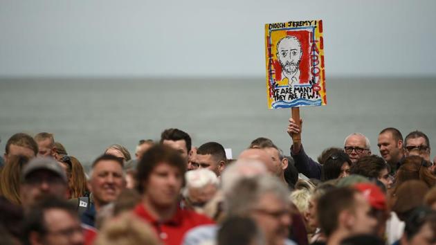 Supporters of Britain's main opposition Labour Party hold placards as they wait for the leader Jeremy Corbyn to arrive at a campaign visit in Colwyn Bay, on the eve of the general election. (Oli Scarff/AFP) Supporters of Britain's main opposition Labour Party hold placards as they wait for the leader Jeremy Corbyn to arrive at a campaign visit in Colwyn Bay, on the eve of the general election. (Oli Scarff/AFP)