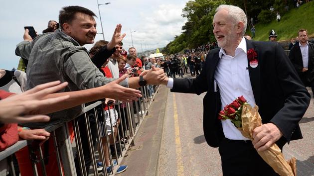 Britain's main opposition Labour Party leader Jeremy Corbyn greets supporters as he leaves after attending a campaign visit in Colwyn Bay, north Wales, on June 7, 2017, on the eve of the general election. Britain on Wednesday headed into the final day of campaigning for a general election darkened and dominated by jihadi attacks in two cities, leaving forecasters struggling to predict an outcome on polling day. (AFP) Britain's main opposition Labour Party leader Jeremy Corbyn greets supporters as he leaves after attending a campaign visit in Colwyn Bay, north Wales, on June 7, 2017, on the eve of the general election. Britain on Wednesday headed into the final day of campaigning for a general election darkened and dominated by jihadi attacks in two cities, leaving forecasters struggling to predict an outcome on polling day. (AFP)