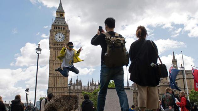 Tourists gather near the Elizabeth Tower, commonly referred to as Big Ben, at the Houses of Parliament in central London. (Justin Tallis/AFP) Tourists gather near the Elizabeth Tower, commonly referred to as Big Ben, at the Houses of Parliament in central London. (Justin Tallis/AFP)