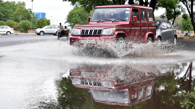 A view of waterlogged road in Chandigarh. Rainfall has been predicted till Saturday before temperature starts rising again. (Sikander Singh/Hindustan Times)