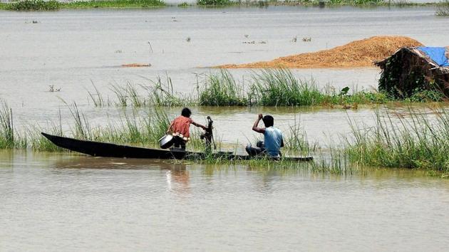 A girl collects water from a hand-pump in flood-hit Mayong village. (PTI)