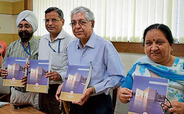 (From left) Controller of examination Parvinder Singh, former dean instructions Dinesh Kumar, PU V-C Arun Grover and dean university instructions Minakshi Malhotra releasing a handbook of information at the PU on Wednesday. (Sikander Singh Chopra/HT) (From left) Controller of examination Parvinder Singh, former dean instructions Dinesh Kumar, PU V-C Arun Grover and dean university instructions Minakshi Malhotra releasing a handbook of information at the PU on Wednesday. (Sikander Singh Chopra/HT)