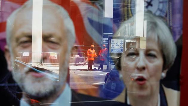 Workers in protective equipment are reflected in the window of a betting shop with a display inviting customers to place bets on the result of the general election with images of Britain's Prime Minister Theresa May and opposition Labour Party leader Jeremy Corbyn, in London. (Marko Djurica/REUTERS) Workers in protective equipment are reflected in the window of a betting shop with a display inviting customers to place bets on the result of the general election with images of Britain's Prime Minister Theresa May and opposition Labour Party leader Jeremy Corbyn, in London. (Marko Djurica/REUTERS)