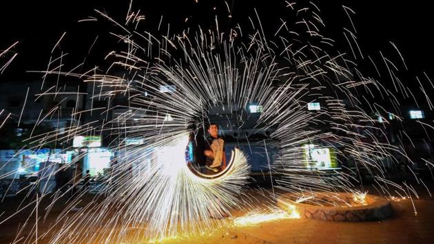 A Palestinian man plays with fire crackers celebrating Ramadan at the town of Rafah in the southern Gaza Strip. (AFP) A Palestinian man plays with fire crackers celebrating Ramadan at the town of Rafah in the southern Gaza Strip. (AFP)