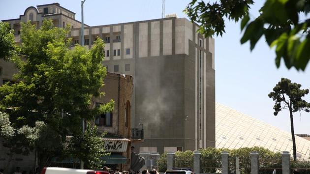 Smoke billows during a shooting and suicide explosion at the parliament building in central Tehran. (REUTERS)