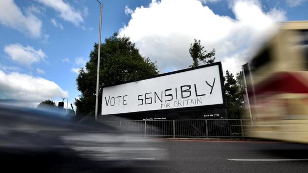 Traffic passes a poster ahead of the forthcoming general election in south London. (Hannah McKay/REUTERS) Traffic passes a poster ahead of the forthcoming general election in south London. (Hannah McKay/REUTERS)