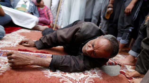A man lies on the ground as he receives fatigue treatment during a day of fasting in Sanaa. (REUTERS) A man lies on the ground as he receives fatigue treatment during a day of fasting in Sanaa. (REUTERS)