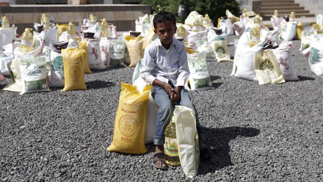 A Yemeni boy sits next to food aid distributed by a local charity during the Muslim holy fasting month of Ramadan, in the capital Sanaa. (AFP) A Yemeni boy sits next to food aid distributed by a local charity during the Muslim holy fasting month of Ramadan, in the capital Sanaa. (AFP)