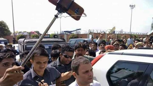 As soon as Rahul Gandhi arrived at the airport, hundreds of Congress workers reached to welcome him. Soon party workers got exited and started taking selfies with Gandhi.(HT PHOTO)