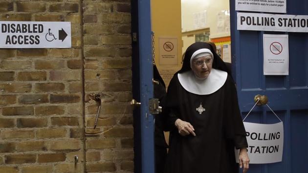 A Benedictine nun from Tyburn Convent leaves after voting in Britain's general election at a polling station in St John's Parish Hall. (Matt Dunham / AP) A Benedictine nun from Tyburn Convent leaves after voting in Britain's general election at a polling station in St John's Parish Hall. (Matt Dunham / AP)