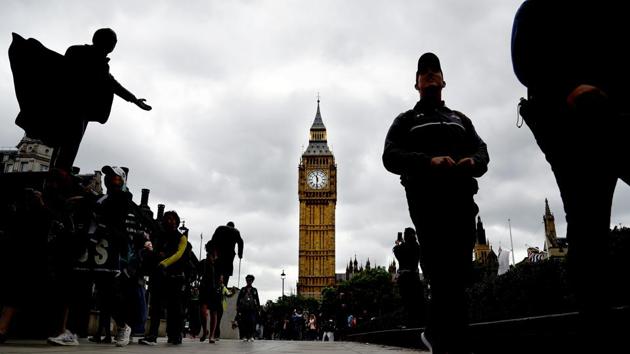 People walk around Parliament Square on election day in Westminster, London, on June 8, 2017. Polling stations opened across Britain on Thursday amid heightened security worries following a series of terror attacks in what one senior police official described as "unprecedented times'.' (AP) People walk around Parliament Square on election day in Westminster, London, on June 8, 2017. Polling stations opened across Britain on Thursday amid heightened security worries following a series of terror attacks in what one senior police official described as "unprecedented times'.' (AP)
