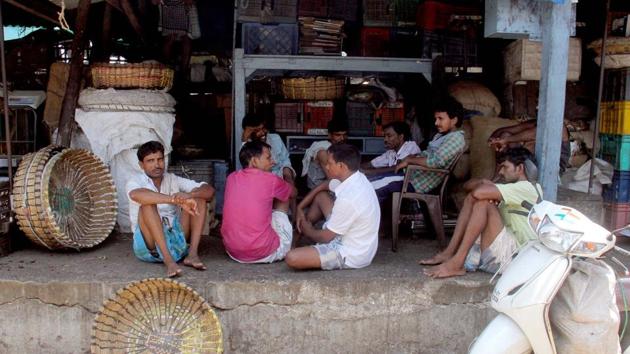 Workers sit idle on the second day of a farmers' strike at Byculla vegetable market, in Mumbai in June. (Bhushan Koyande/ht photo)