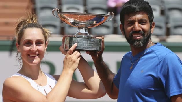 Canada's Gabriela Dabrowski and India's Rohan Bopanna hold the trophy as they celebrate winning their mixed doubles final match. (AP) Canada's Gabriela Dabrowski and India's Rohan Bopanna hold the trophy as they celebrate winning their mixed doubles final match. (AP)