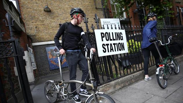 People leave a polling station after voting on general election day in London, Britain on Thursday.(Reuters Photo)