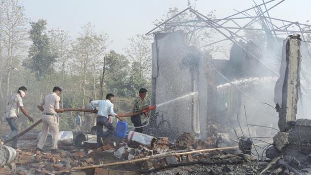 Rescuers try to douse the fire after an explosion in a firecracker factory in Balaghat in Madhya Pradesh. (AP) Rescuers try to douse the fire after an explosion in a firecracker factory in Balaghat in Madhya Pradesh. (AP)