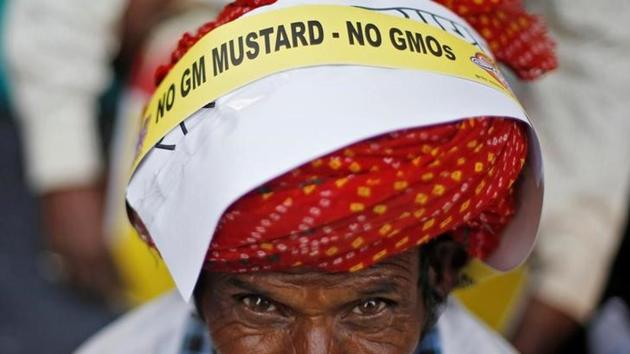 A farmer attends a protest against what they say is India's plan to allow genetically modified (GM) mustard crop . Still under consideration for approval, the indigenously developed mustard variant would be the second genetically modified crop passed by Indian lawmakers since BT cotton 15 years ago. (Adnan Abidi/reuters)