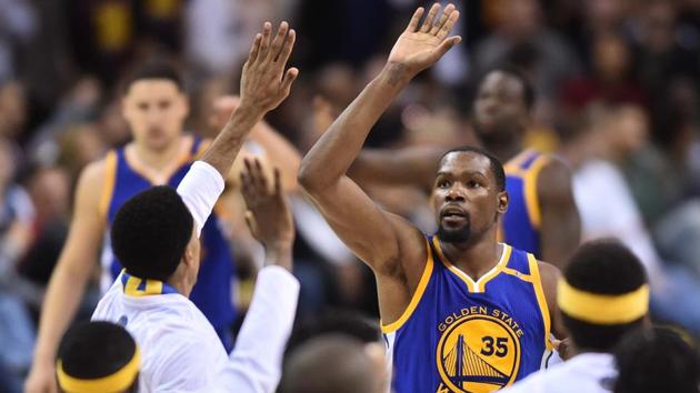 Golden State Warriors forward Kevin Durant (35) celebrates with teammates during the fourth quarter against the Cleveland Cavaliers in game three of the 2017 NBA Finals.(USA Today Sports)