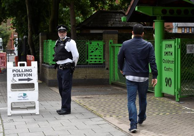 A police officer stands on duty outside a polling station in London on Thursday. (Reuters) A police officer stands on duty outside a polling station in London on Thursday. (Reuters)
