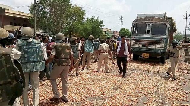 Farmers throw onions and other vegetables on the road during their protest in Shajapur on Thursday. (PTI Photo) Farmers throw onions and other vegetables on the road during their protest in Shajapur on Thursday. (PTI Photo)