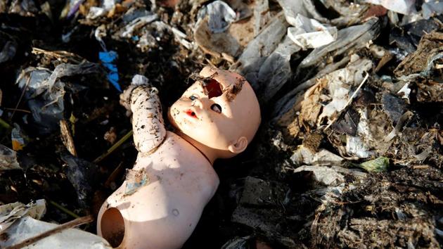 A plastic doll in debris at a landfill in Montevideo, Uruguay. Plastic debris is a constant risk to the delicate balance of life in corals already under threat from climate change. Secretary-General Antonio Guterres on Monday, June 5, 2017, opened the first-ever UN conference on oceans with a warning that the lifeblood of the planet is ‘under threat as never before,’ with one recent study warning that discarded plastic garbage could outweigh fish by 2050 if nothing is done. (Andres Stapff/REUTERS)