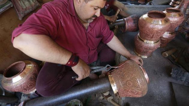 The traditional samavar is used to prepare and serve Kashmiri salted tea (noon chai) and kahwa. The makers say to make one samovar it takes almost a month – comprising of several lengthy steps. (Waseem Andrabi/HT Photo)