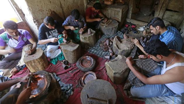 A large range of crockery products are made out of copper in Kashmir, including samavars (tea kettle), pots, glasses, jugs, plates, serving bowls, cooking pots. (Waseem Andrabi/HT Photo)