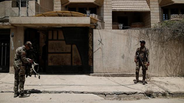 Members of the Iraqi Army stand outside a compound used as a prison by Islamic State militants in western Mosul. (Alkis Konstantinidis /REUTERS) Members of the Iraqi Army stand outside a compound used as a prison by Islamic State militants in western Mosul. (Alkis Konstantinidis /REUTERS)