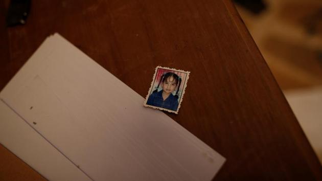 The photo of an unidentified girl is seen on a desk inside. When people were taken in as prisoner inmates their documents and belongings were taken away, to be returned during their release. (Alkis Konstantinidis /REUTERS) The photo of an unidentified girl is seen on a desk inside. When people were taken in as prisoner inmates their documents and belongings were taken away, to be returned during their release. (Alkis Konstantinidis /REUTERS)