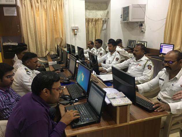 The traffic police staff sitting in the control room send around 3,000 to 4,000 messages which contain the description and picture of the vehicle captured during the traffic rule violation. (HT PHOTO)
