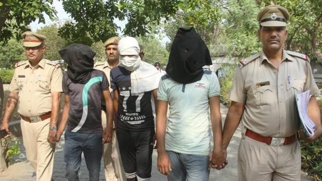 Police taking all three accused in the gang rape case of a woman and murder of her infant daughter to a court in Manesar area of Gurugram on Thursday.(PTI)