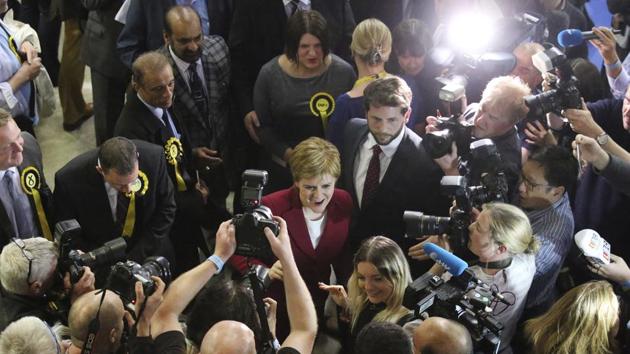 Scotland's First Minister Nicola Sturgeon (C), arrives as votes are counted for the general election, at the Emirates Arena in Glasgow, Scotland. (Andrew Milligan/AP) Scotland's First Minister Nicola Sturgeon (C), arrives as votes are counted for the general election, at the Emirates Arena in Glasgow, Scotland. (Andrew Milligan/AP)