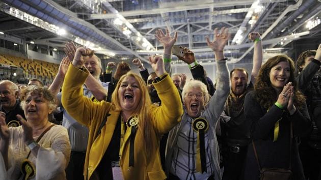 Scottish National Party (SNP) activists celebrate at the main Glasgow counting centre hours after the polls closed in Britain's general election. (Andy Buchanan/AFP) Scottish National Party (SNP) activists celebrate at the main Glasgow counting centre hours after the polls closed in Britain's general election. (Andy Buchanan/AFP)
