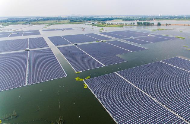 Floating on a lake over a collapsed coal mine ,farm can generate 40 megawatts of electricity. (AFP)