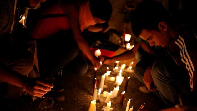 People light candles during an event in honour of  the 17-year-old protester, the latest fatality from the anti-government unrest in Venezuela. (Carlos Garcia Rawlins/REUTERS) 