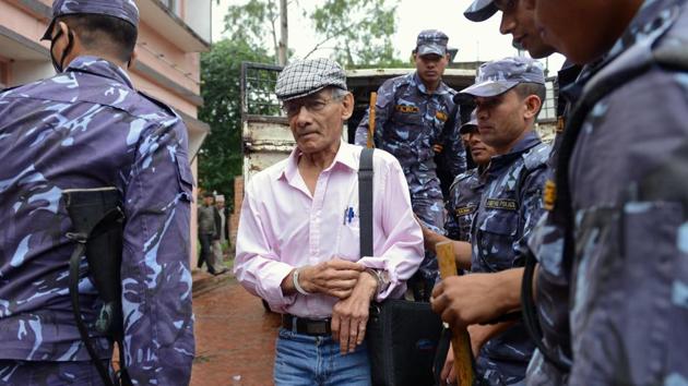 French serial killer Charles Sobhraj (centre) being brought to the district court for a hearing on a case related to the murder of Canadian backpacker Laurent Ormond Carriere, in Bhaktapur on May 26, 2014. (AFP File) French serial killer Charles Sobhraj (centre) being brought to the district court for a hearing on a case related to the murder of Canadian backpacker Laurent Ormond Carriere, in Bhaktapur on May 26, 2014. (AFP File)