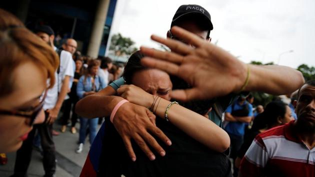 Family members of activist Neomar Lander  react during a gathering in Caracas, Venezuela.  (Ivan Alvarado/REUTERS) 