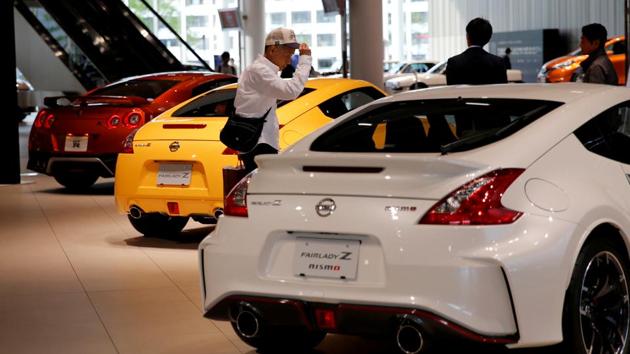 A man walks in the Nissan showroom at the carmaker's headquarters in Yokohama. (Reuters file photo) A man walks in the Nissan showroom at the carmaker's headquarters in Yokohama. (Reuters file photo)