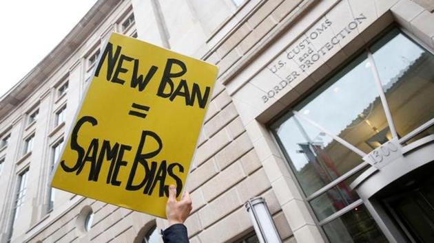 Immigration activists rallying against the Trump administration's ban against travellers from six Muslim-majority nations, outside of the US Customs and Border Protection headquarters in Washington, US, March 7, 2017. (Reuters) Immigration activists rallying against the Trump administration's ban against travellers from six Muslim-majority nations, outside of the US Customs and Border Protection headquarters in Washington, US, March 7, 2017. (Reuters)