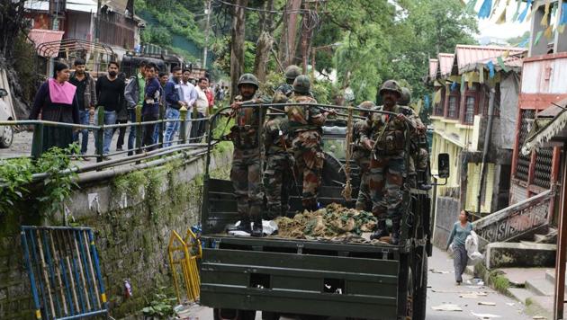 Army personnel patrol the streets on Friday after clashes between police and GJM supporters in Darjeeling.(AFP)