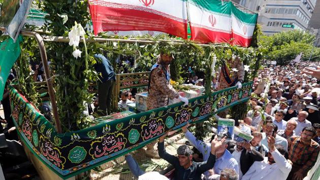 Iranians march during the funeral of the victims of the attacks on Tehran's parliament complex and the shrine of revolutionary leader Ayatollah Ruhollah Khomeini, in the capital Tehran on June 9, 2017. (AFP Photo) Iranians march during the funeral of the victims of the attacks on Tehran's parliament complex and the shrine of revolutionary leader Ayatollah Ruhollah Khomeini, in the capital Tehran on June 9, 2017. (AFP Photo)